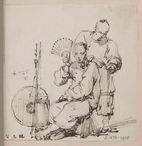 A Chinese barber with a seated customer