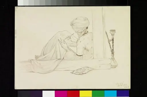 A Turbaned man drawing a pattern on to a piece of cloth