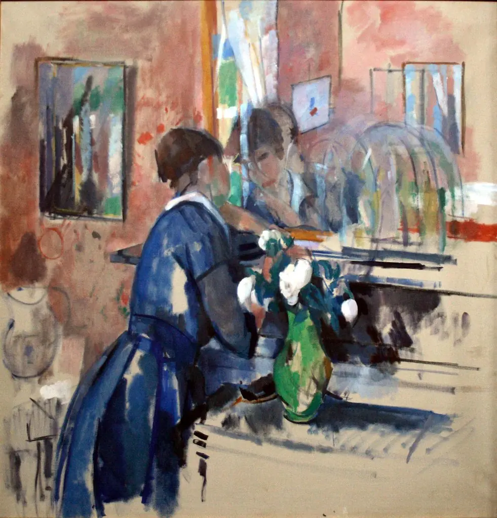 Lady in blue in front of a mirror