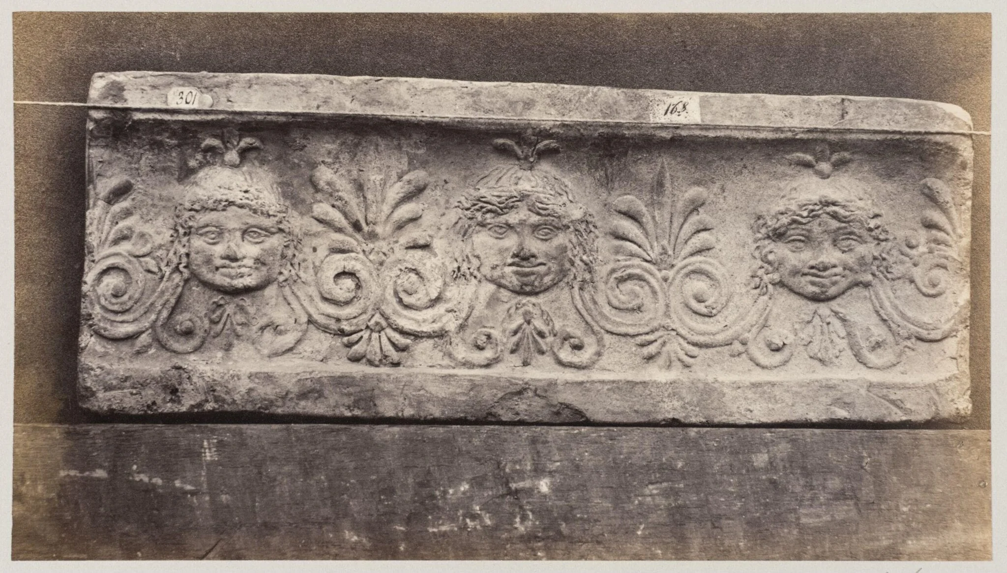 Three masques of gorgons in terra cotta, by Louise Laffon, photographic, 1864