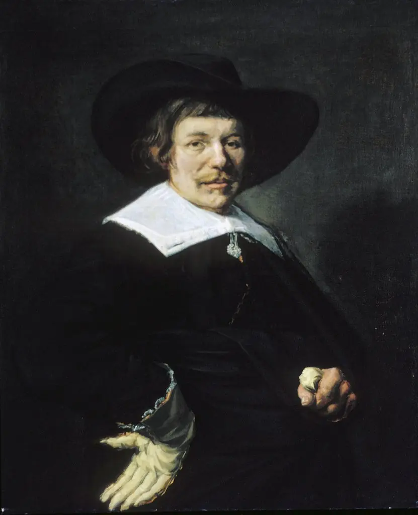Portrait of a man with tassle collar and floppy hat