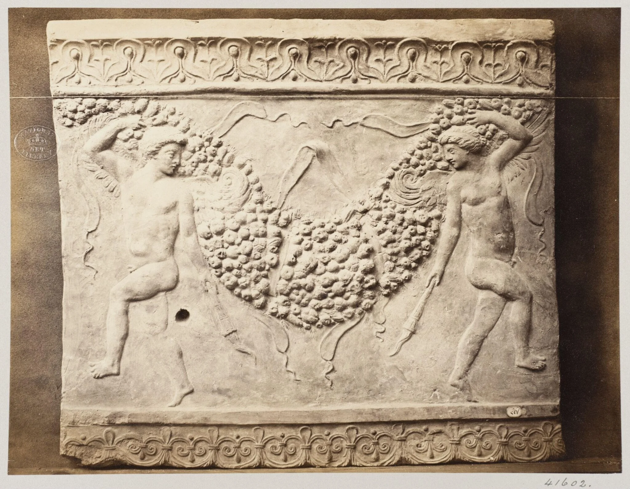 Bas-relief of portion of frieze of dancing figures with torches bearing festoon of fruit in terra cotta, by Louise Laffon, photographic, 1864
