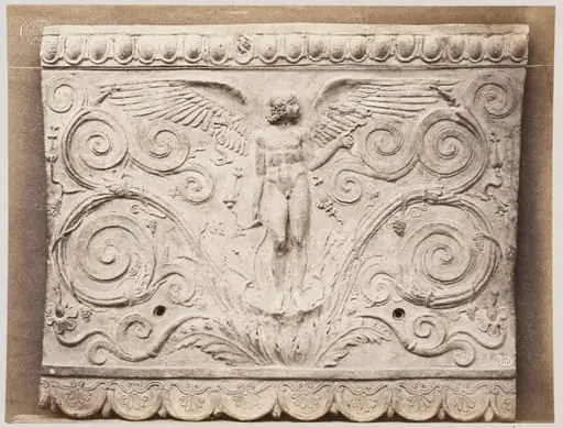 Bas-relief of a portion of frieze of Eros with scrollwork in terra cotta