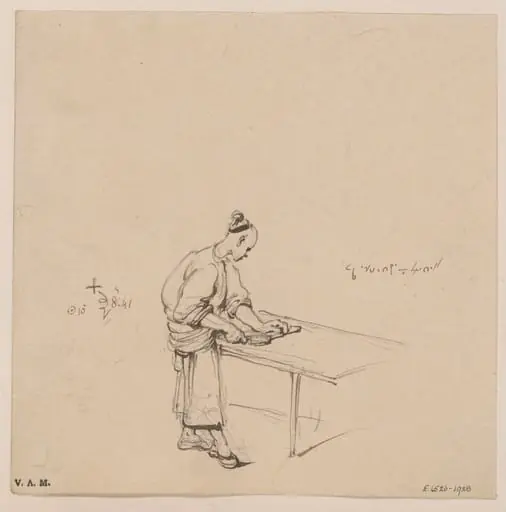 A Chinese man cutting paste