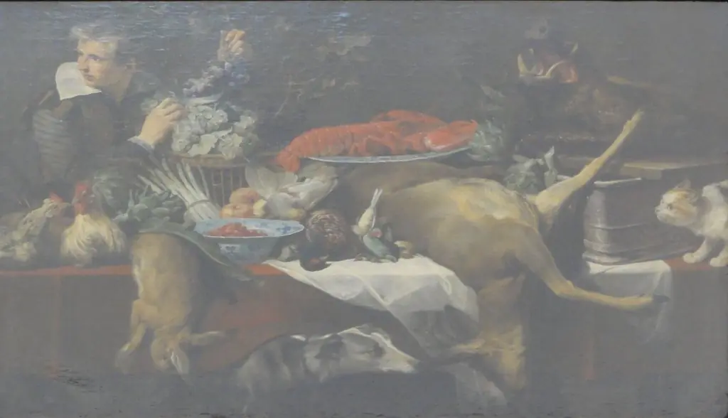Kitchen scene with game and vegetables, with a serving boy holding a bunch of grapes