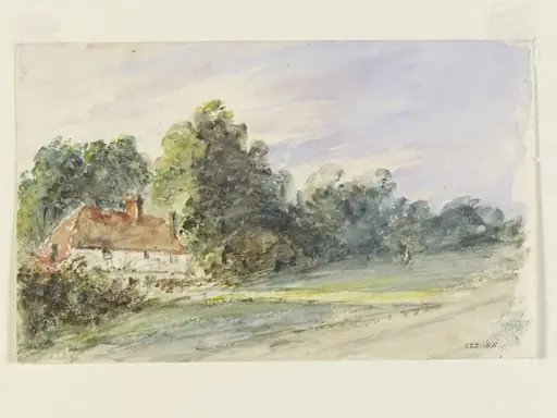 A cottage with a red-tiled roof, by a wood