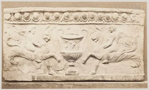Bas-relief of a large vessel with handles and two bacanallian genies in terra cotta