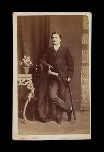  portrait of a man holding an umbrella and top hat