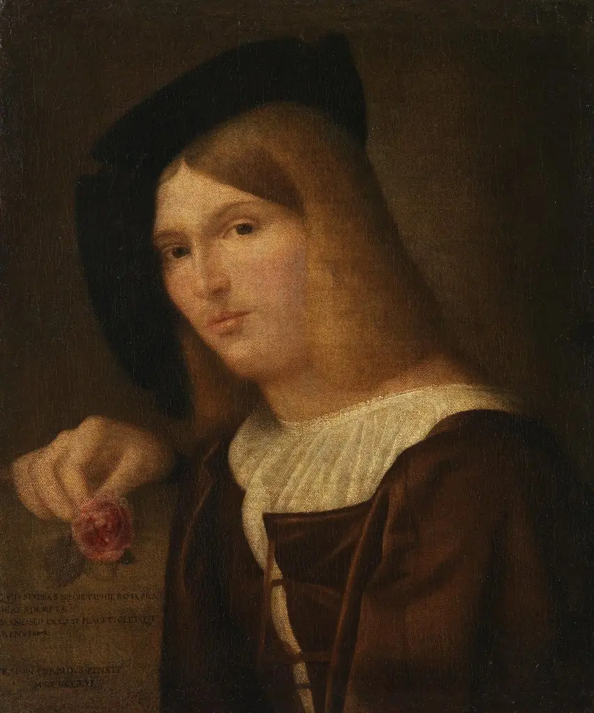 Portrait of a young man with a rose in his hand