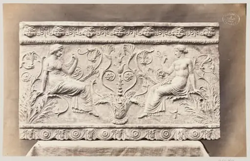 Two female figures seated on foliage ornament, bas-relief in terra cotta