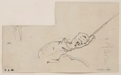 An arm and hand holding a stick