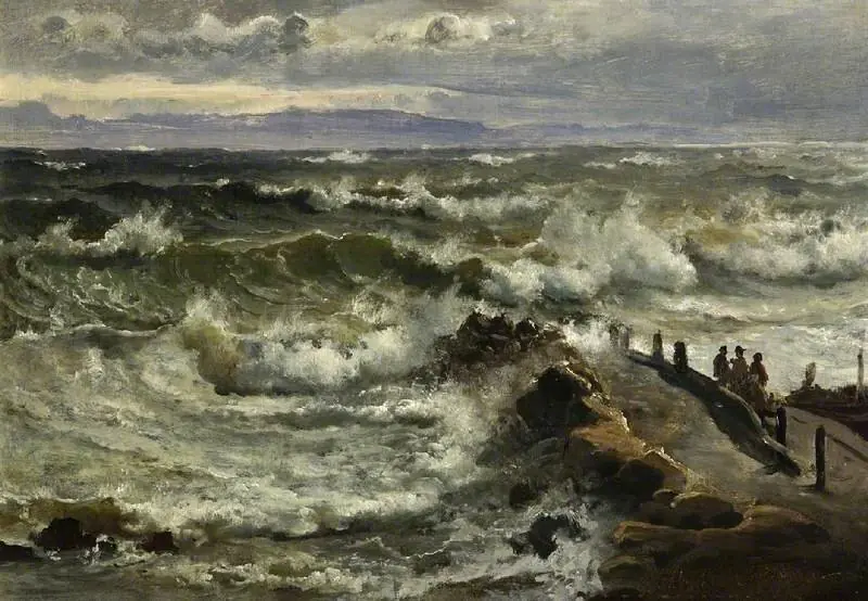 Rough sea beside a jetty