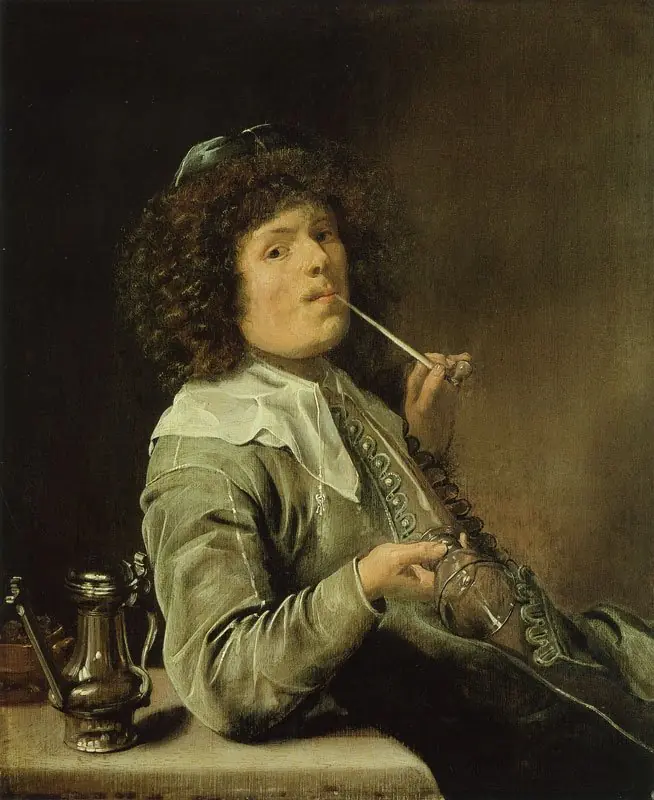 A smoking man with an empty wine glass