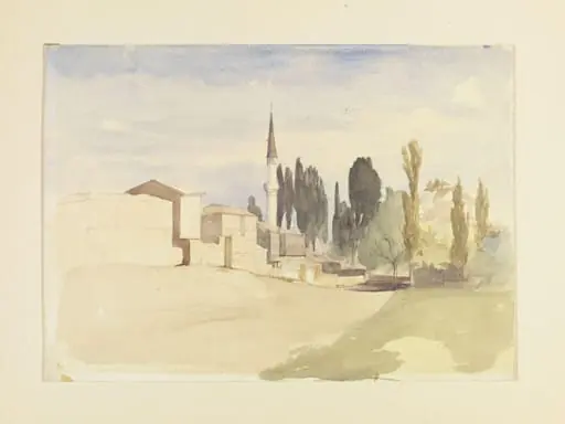 A group of houses, a minaret and cypress trees