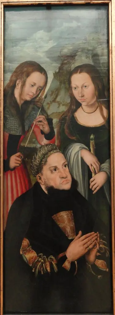 The Elector Frederic the Wise of Saxony (1463-1525) with the Saints Ursula (left) and Genevieve (right)