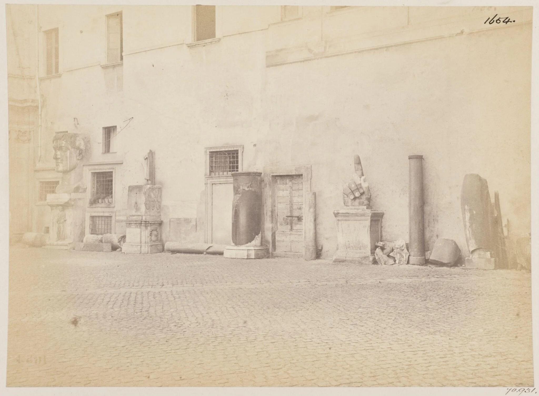 Sculpture - View on the left side of the Court-yard of the Palazzo de' Conservatori on the Capitol, shewing fragments of colossal Statues, by John Henry Parker, photographic, 1867