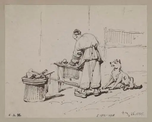 A Chinese man stooping over a table, watched by a dog