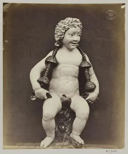Enamelled earthenware statuette of a child