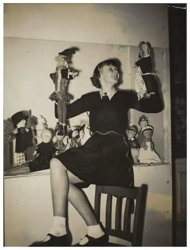 Photograph of Molly Sheldrake, taken to advertise the opening of the 13th Exhibition of the British Puppet and Model Theatre Guild, 1938