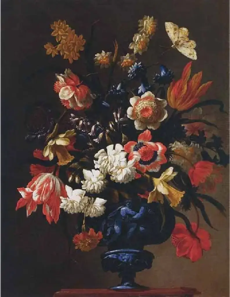 Flowers in a blue sculpted vase