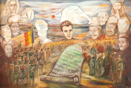 Tablou, ulei pe pânză, executat de Cercul Pionerilor din Drăgănești. A fost realizat, probabil, pentru aniversarea centenarului Independenței (1977). În parte inferioară este reprezentată trercerea Dunării de către armatele române (inspirat dintr-o coromolitografie a Institutuli de Arte Grafice București). În centrul tabloului este figura lui Nicolae Ceaușescu și un pergament pe care este notat jurământul rostit la investitură ”Jur că îmi voi face întodeauna datoria cu cinste și devotament pentru strălucirea și măreția națiunii noastre socialiste a Republicii Socialiste România”. Pe fundal chipurile eroilor neamului ce-l veghează pe ”marele erou” : Dimitrie Cantemir, Ioan Vodă cel Cumplit, Alexandru cel Bun, Avram Iancu, Constantin Brâncoveanu, Matei Basarab, Neagoe Basarab, Iancu de Hunedoara, Vlad Țepeș, Mihai Viteazul, Alexandru Ioan Cuza, Tudor Vladimirescu. Comandat și oferit de Comitetul Județean de Partid Olt, 24 ianuarie 1978.