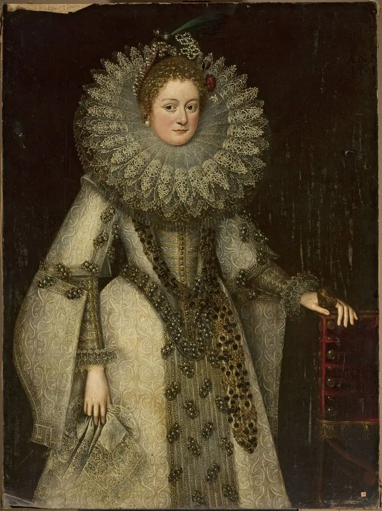 Portrait of a lady in a rich costume leaning on the armchair