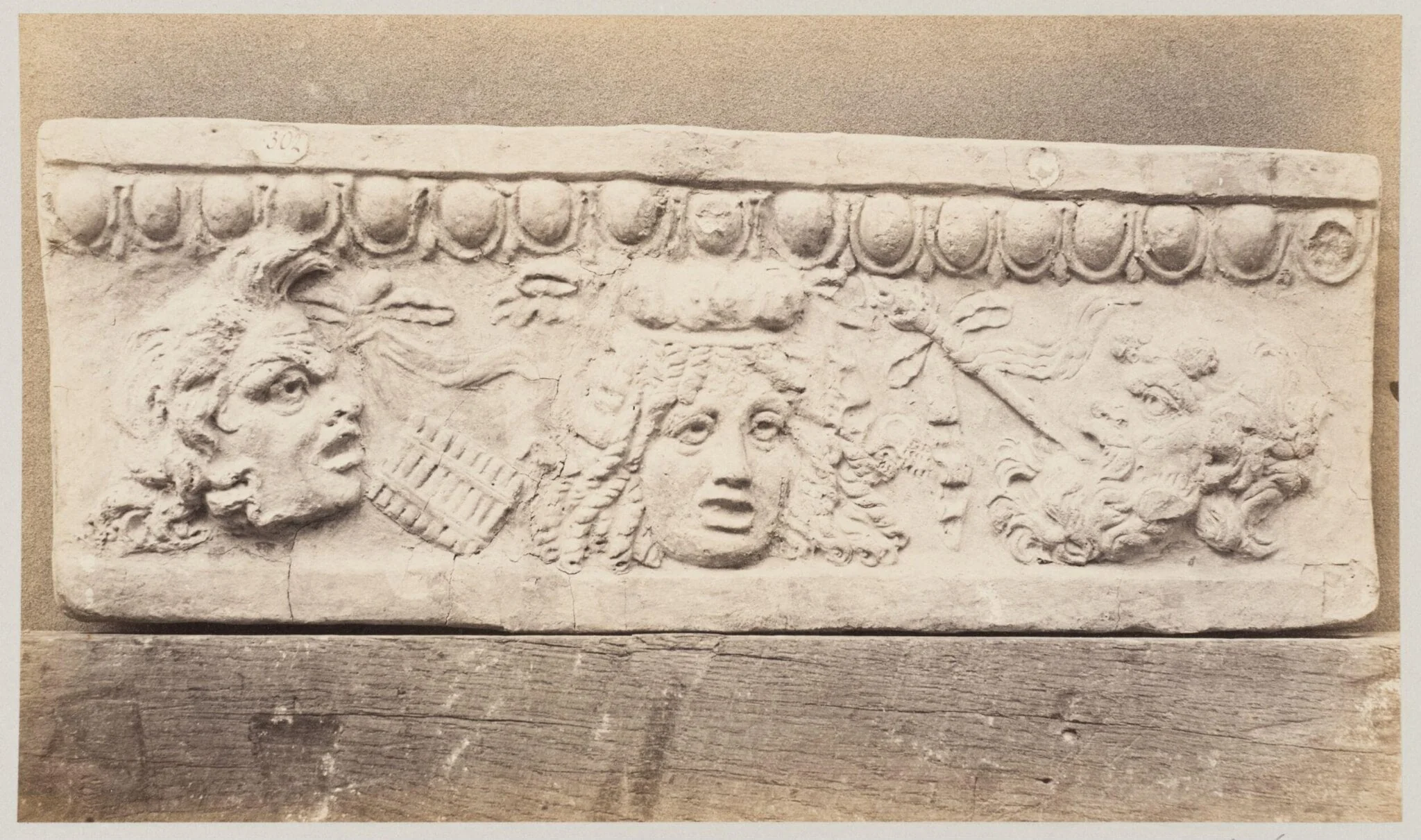 Bas-relief portion of frieze with theatrical masks in terra cotta, by Louise Laffon, photographic, 1864