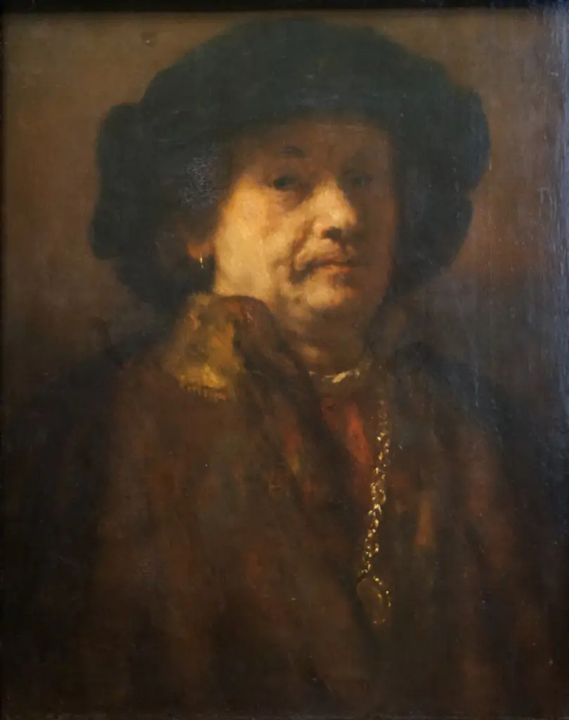 Self-portrait in a fur coat with gold chain and earring