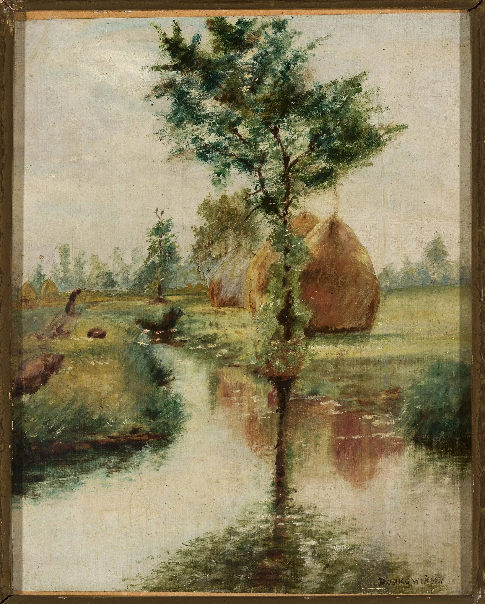 Haystacks at a stream