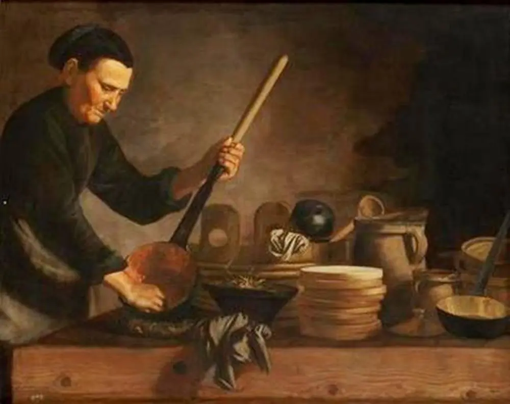 Old woman, cleaning a steel pan