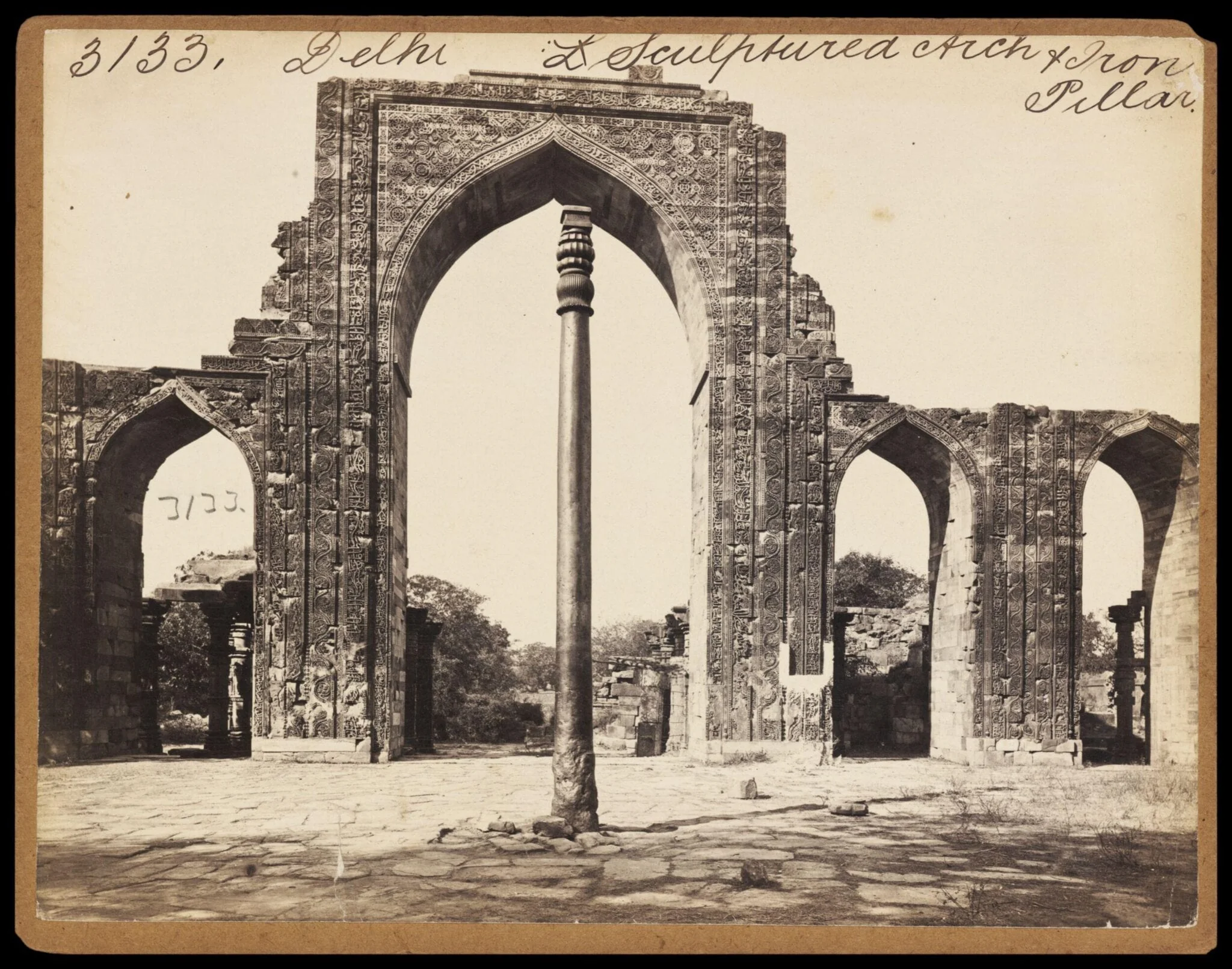 Delhi.  Sculptured Arch & Iron Pillar