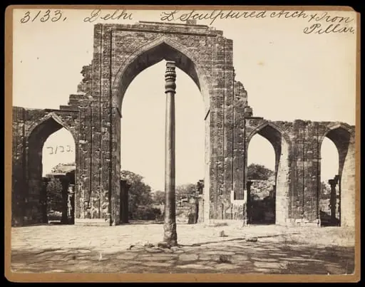 Delhi.  Sculptured Arch & Iron Pillar