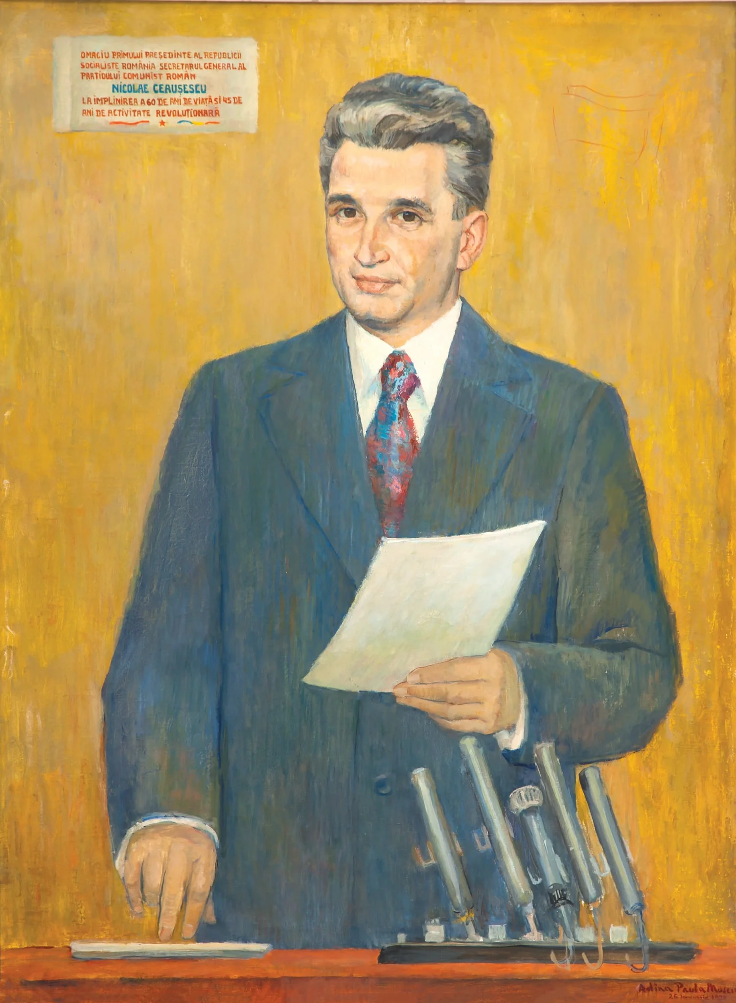 Tablou reprerzentându-l pe Nicolae Ceauțescu ținând un discurs. Semnat în partea dreaptă jos ”Adina Paula Moscu”. Oferit cadou lui Nicolae Ceaușescu pe 26 ianuarie 1978 cu ocazia aniversării vârstei de 60 de ani. În stânga sus dedicație ”Omagiu primului președinte al Republicii Socialiste România, secretar general al Partidului Comunist Român, Nicolae Ceaușescu, la împlinirea a 60 de ani de viață și 45 de ani de activitate revoluționară.”