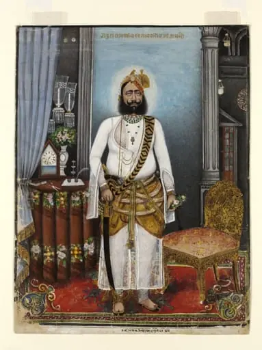 Portrait of Thakur Raja Bakhtawar Singh, standing in a European-style interior.