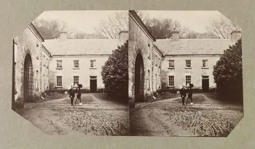 West Wing of Dundrum House with unidentified man with camera on tripod