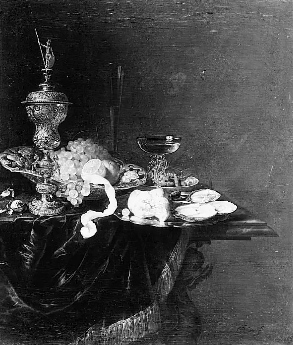 Still life with Akelei covered beaker dish of grapes, lemon and wine glasses