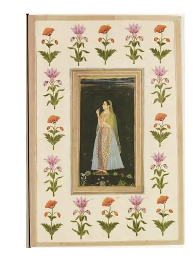 a lady holding a blossom