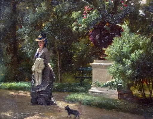Femeie cu cățelul în parc