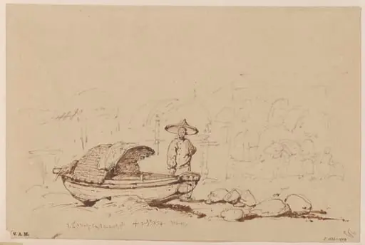 A boatman beside a beached Tanka boat