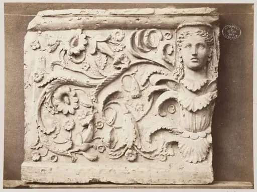 Bas-relief portion of frieze of female head and foliage ornament in terra cotta