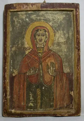 Sfânta Cuvioasă Paraschiva este redată 3/4, frontal, într.o manieră naivă, specific țărănească. Chip oval, trăsăturile feței accentuate, ochii conturați cu negru, privirea îndreptată lateral, scrâncenele mult arcuite, nările mari, gura mică. Mâna stângă o ține la piept, dreapta ridicată în semnde binecuvântare. Înveșmântată cu un maforion roșu pal, cu decorațiuni vagi, albe, stola verde cu galben, porțiune decorată cu motive fitomorfe.Nimb galben cu linia de contur albă. Fond grena în partea de jos, gri în cea superioară. Chenar dublu, galben + grena.