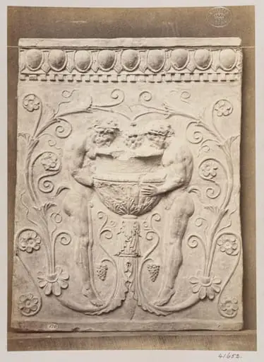 Bas-relief of a portion of a frieze showing two satyrs and a vessel in terra cotta