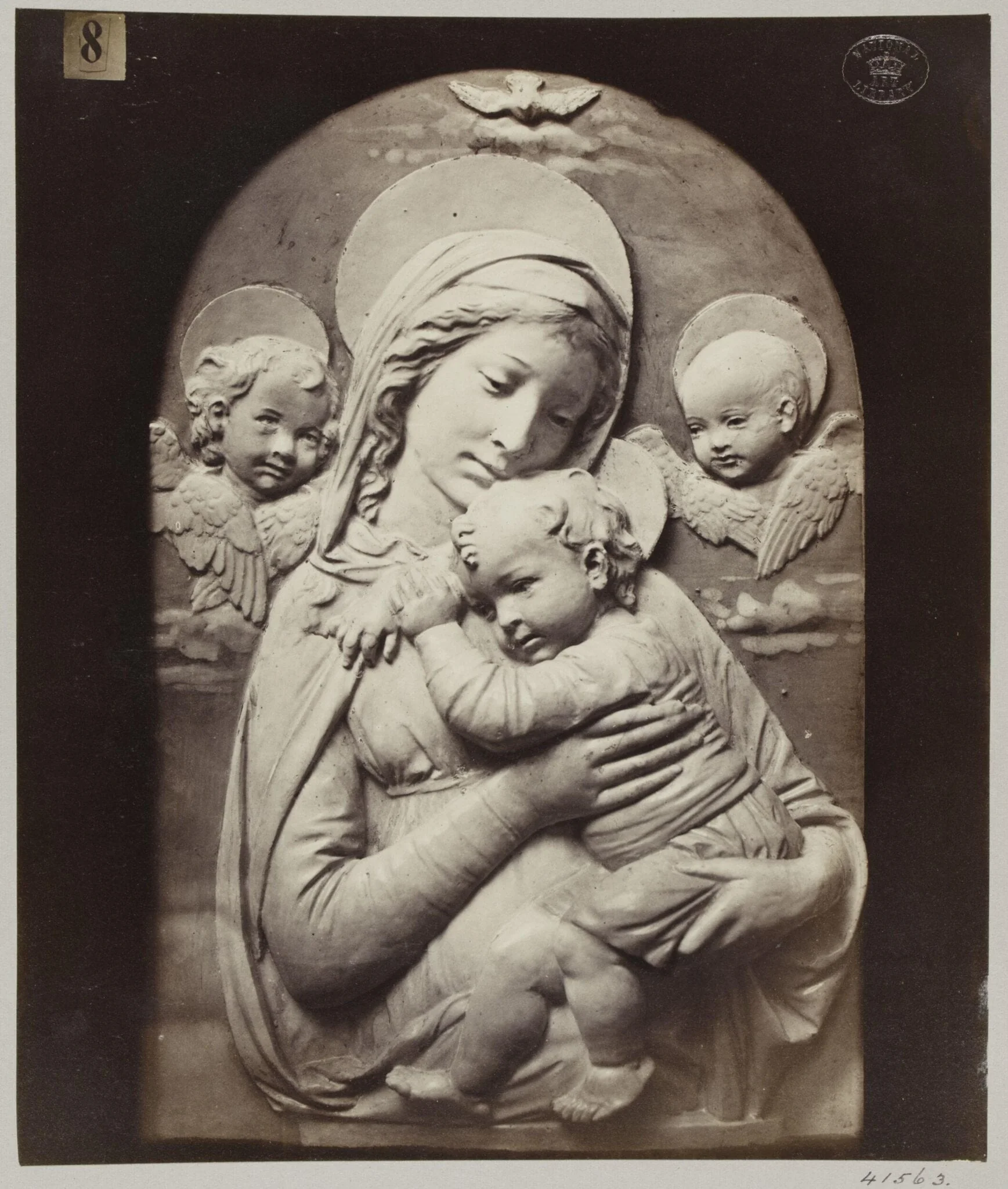 Bas-relief depicting the Virgin and Child in enamelled earthenware