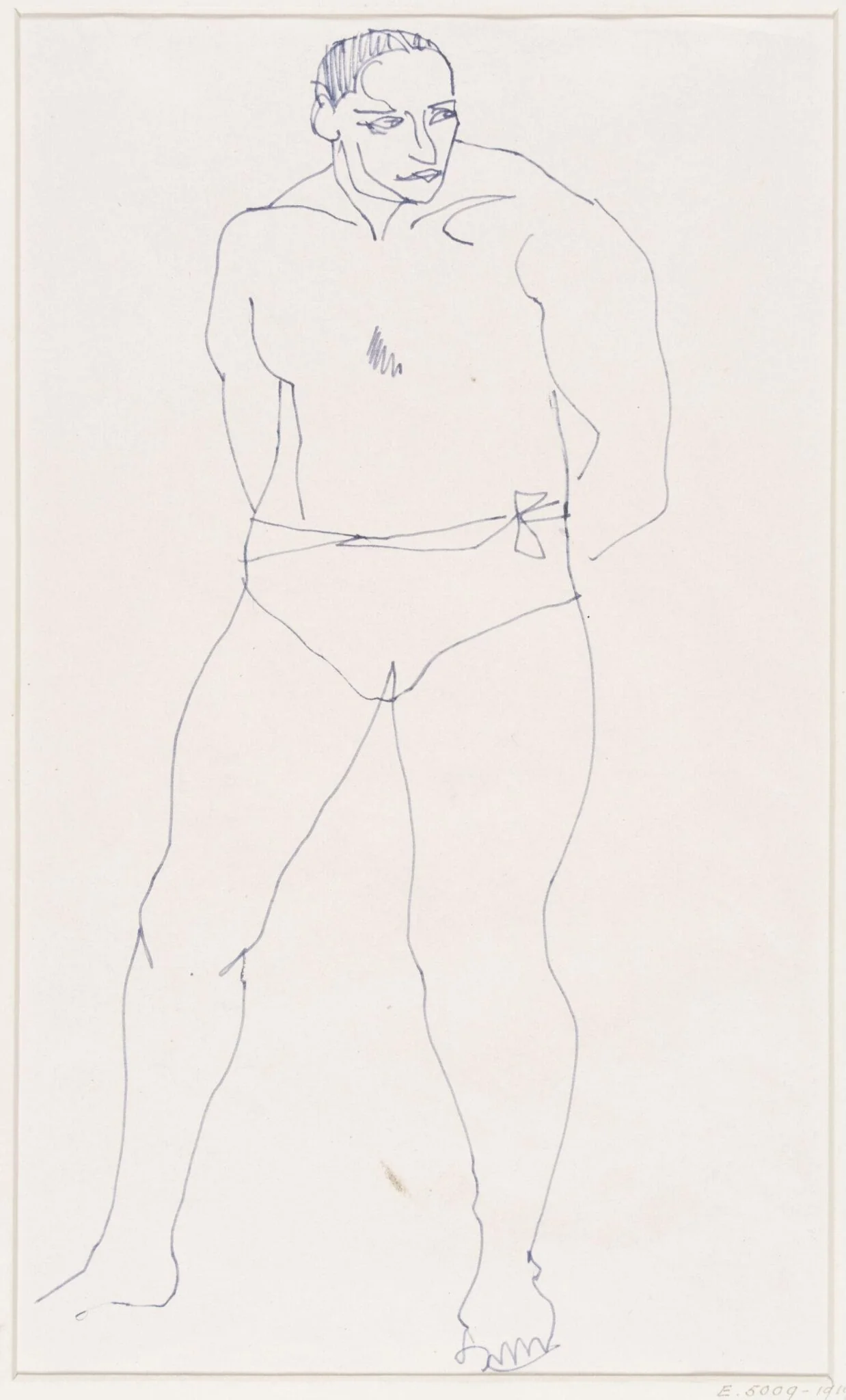A man standing, with hands behind him