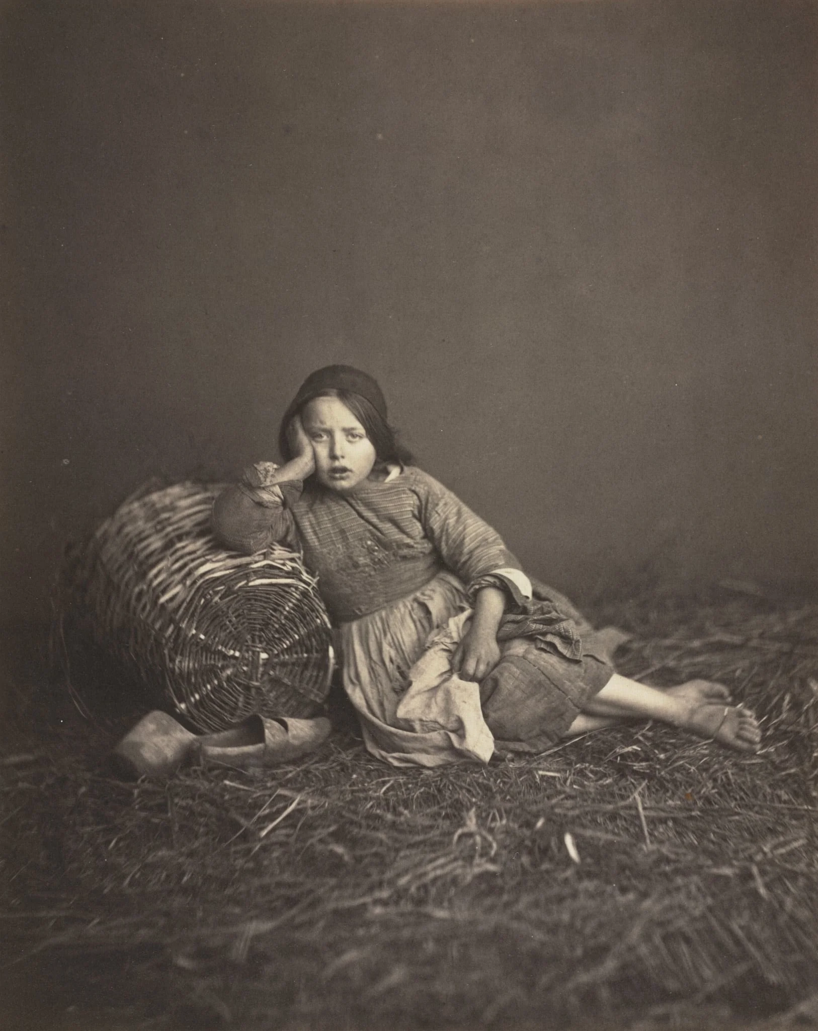 Young Girl Seated on Straw, Leaning on a Basket, by Edmond Bacot, 1862