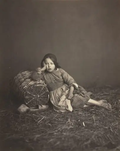 Young Girl Seated on Straw, Leaning on a Basket