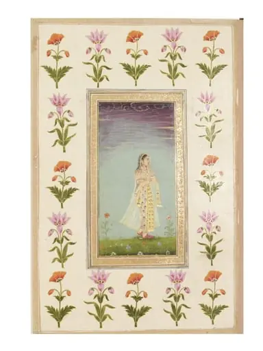 a lady walking through flowers.
