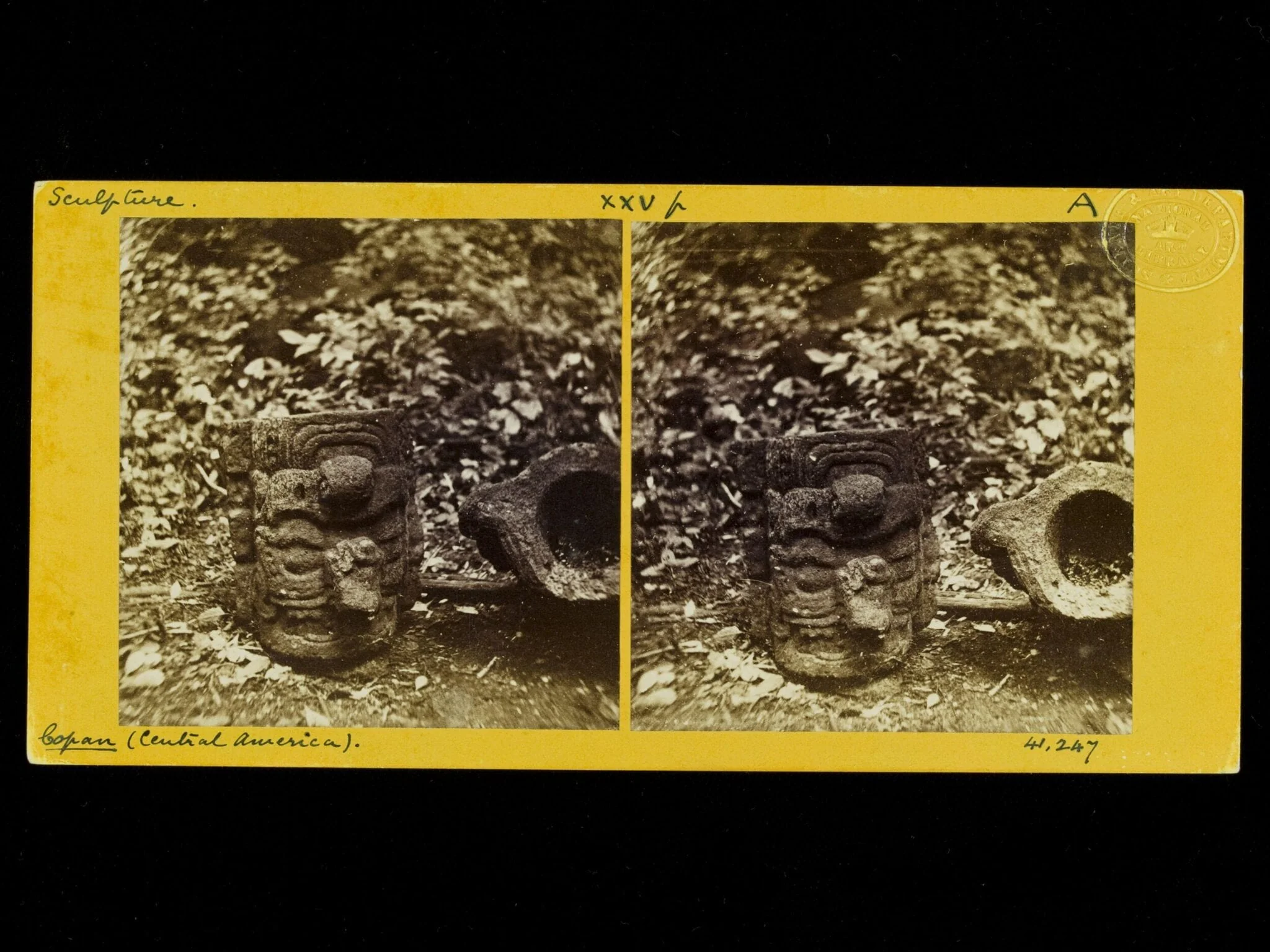 Sculptured stones with faces on one side and hollowed at the top