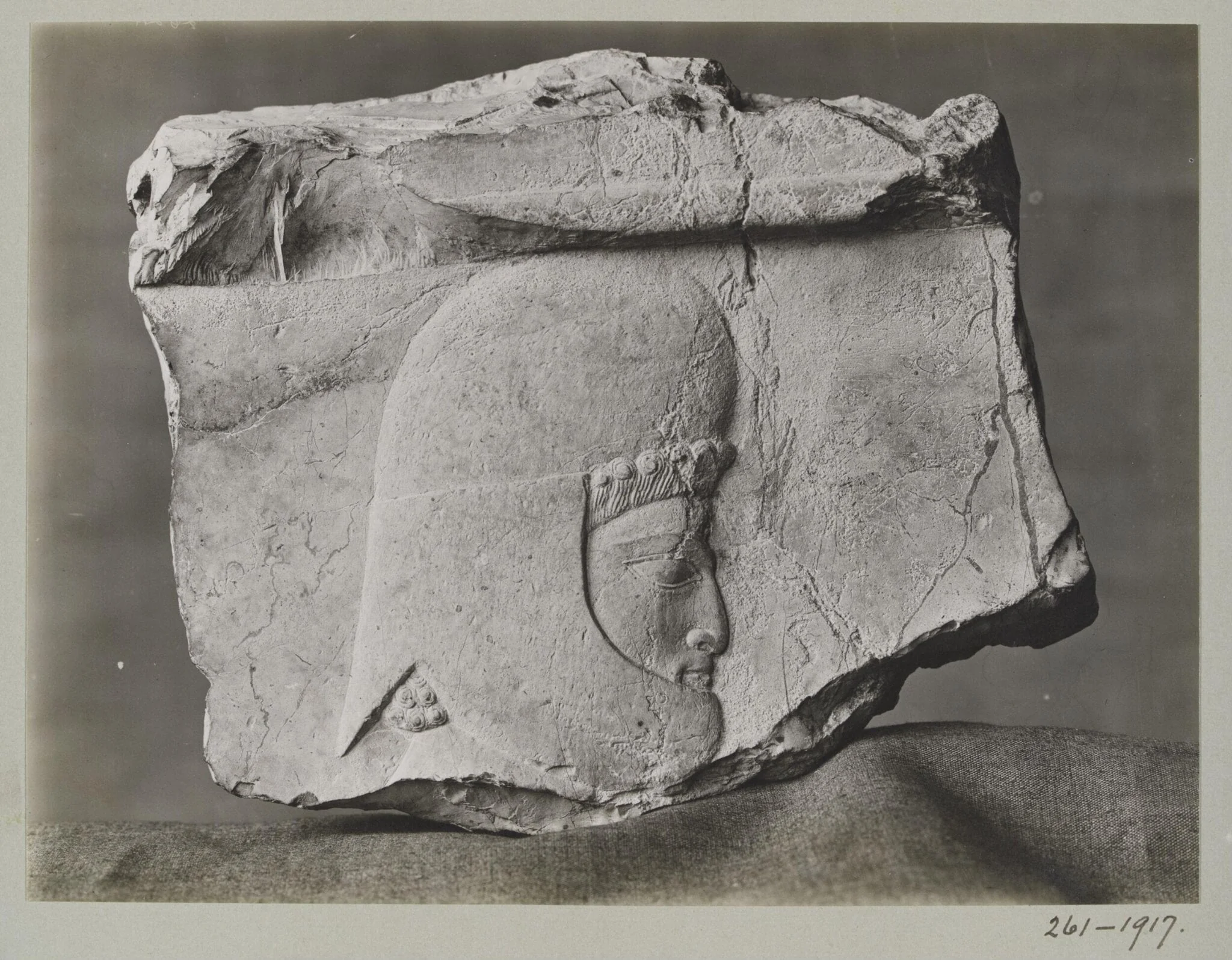 Stone sculpture of a head of a warrior, probably from Palace of Xerxes, by Unknown, photographic, 1917