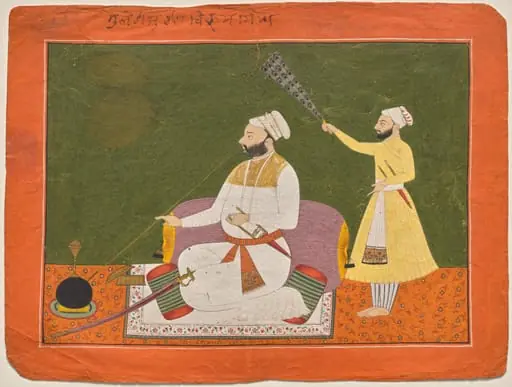 Raja Bikram Singh of Guler smoking a hookah